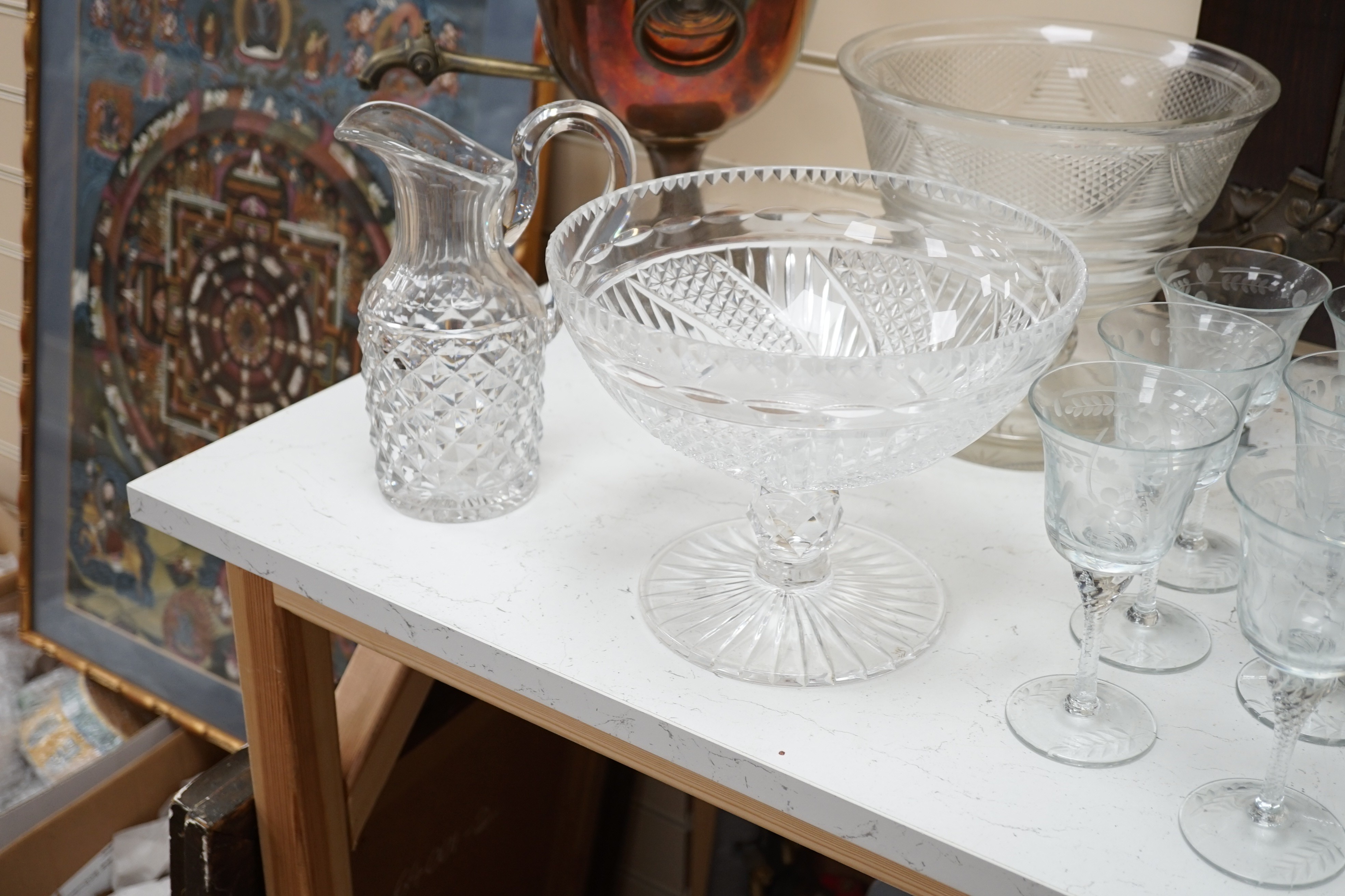 Assorted suites of cut glass wine glasses, brandy balloons, a pedestal water jug, two pedestal bowls